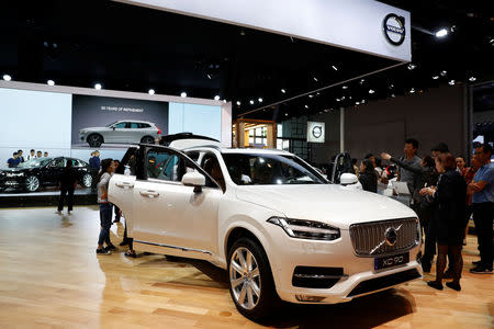 FILE PHOTO: Visitors look at the Volvo XC90 at the Shanghai Auto Show, in Shanghai, China April 20, 2017. REUTERS/Aly Song