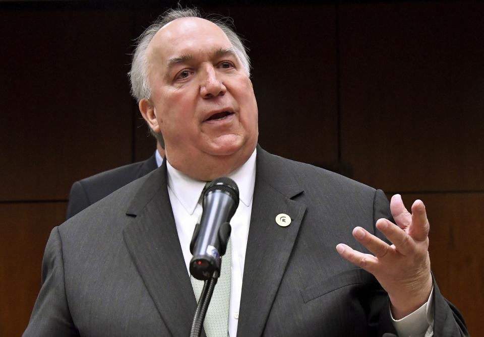 FILE - Former Gov. John Engler runs a news conference, Jan. 31, 2018, in East Lansing, Mich. (Dale G.Young/Detroit News via AP, File)