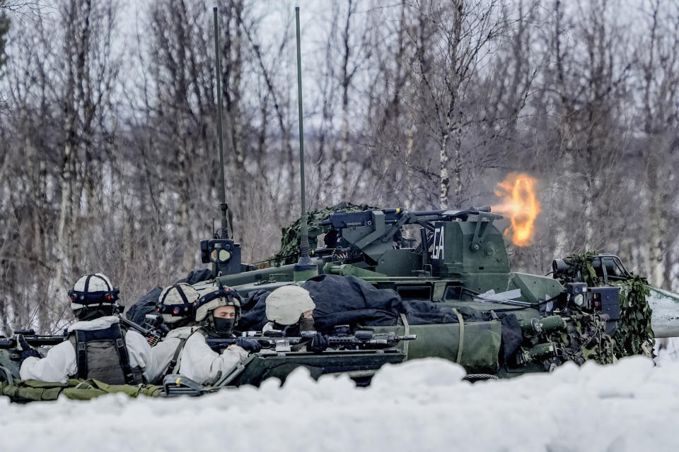 A view of soldiers as forces from Norway, Sweden and Finland during a NATO training exercise, in Kautokeino, Norway, Saturday, March 9, 2024, Large NATO drills in the frigid fjords of northern Norway may be just war games meant to hone the skills of the newly expanded 32-nation military alliance in the event of conflict. But for the troops taking part, they are very real. (Heiko Junge /NTB Scanpix via AP)