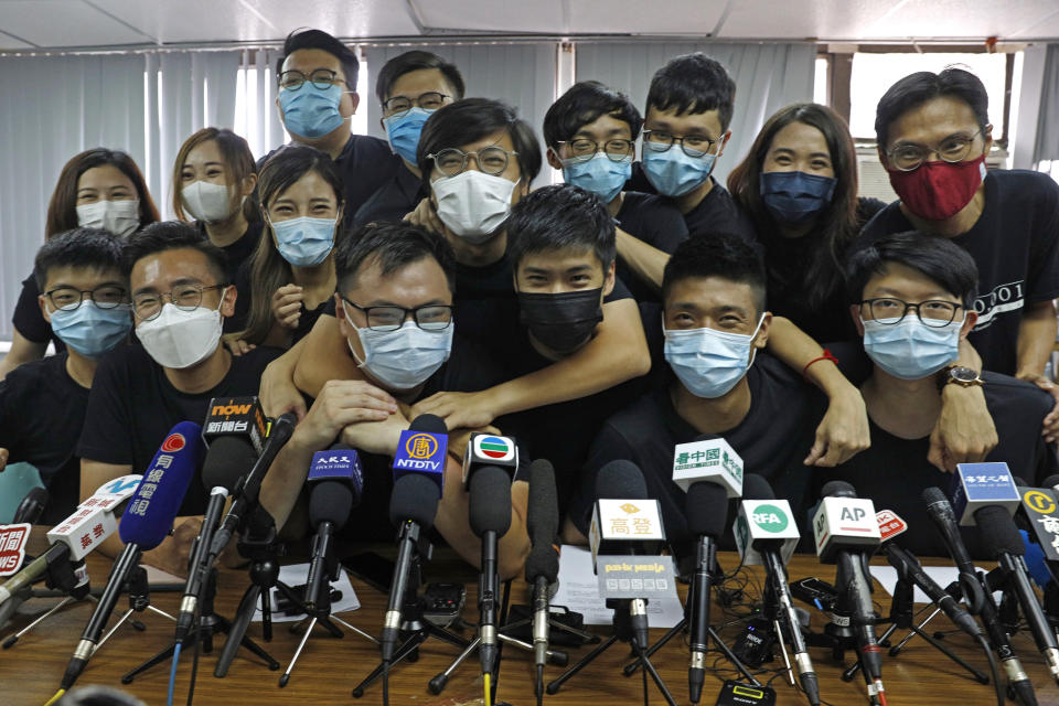 FILE - In this July 15, 2020, file photo, pro-democracy activists who were elected from unofficial pro-democracy primaries, including Joshua Wong, left, attend a press conference in Hong Kong. About 50 Hong Kong pro-democracy figures were arrested by police on Wednesday, Jan. 6, 2021 under a national security law, following their involvement in an unofficial primary election last year held to increase their chances of controlling the legislature, according to local media reports. (AP Photo/Kin Cheung, File)