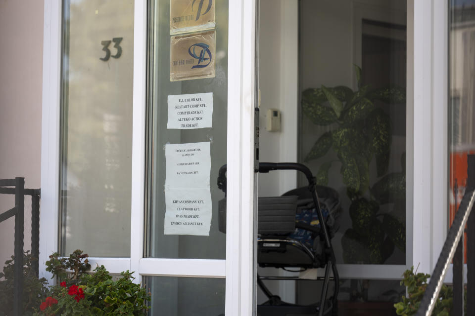 This shows a sign featuring the names of several companies on the door of a house where a Hungarian company that allegedly manufactured pagers that exploded in Lebanon and Syria is headquartered in Budapest Wednesday, Sept. 18, 2024. (AP Photo/Denes Erdos)