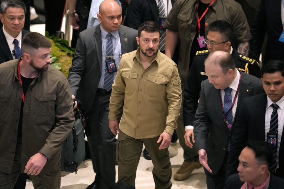 Ukraine’s President Volodymyr Zelenskyy, center, leaves after the 21st Shangri-La Dialogue summit at the Shangri-La Hotel in Singapore, Sunday, June 2, 2024. (AP Photo/Vincent Thian)