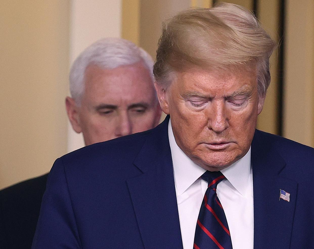 Donald Trump and Mike Pence arrive for a White House briefing on the coronavirus pandemic: Getty Images