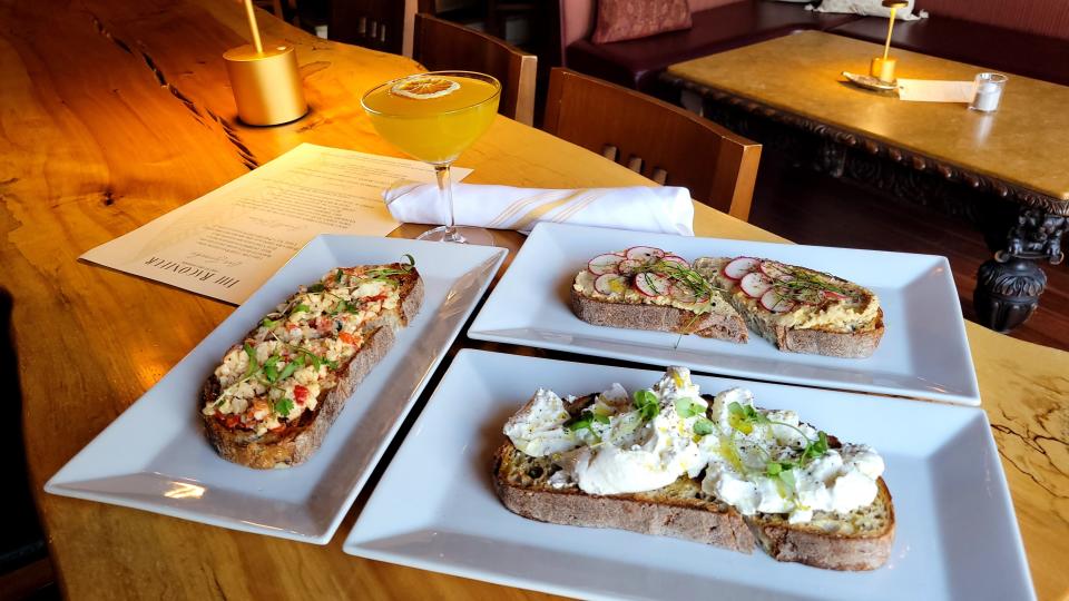 Toast options at The Raconteur Bar & Kitchen in Pleasantville include burratta bruschetta, hummus toast (made to order), and pimiento cheese toast with jalapeño pepper jelly and micro chive.