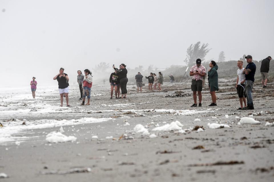 Spectators at Fifth Ave. Park in Indialantic, FL get a closer look at the rough surf and beach erosion in advance of Tropical Storm Nicole Wednesday, November 9, 2022. Craig Bailey/FLORIDA TODAY via USA TODAY NETWORK