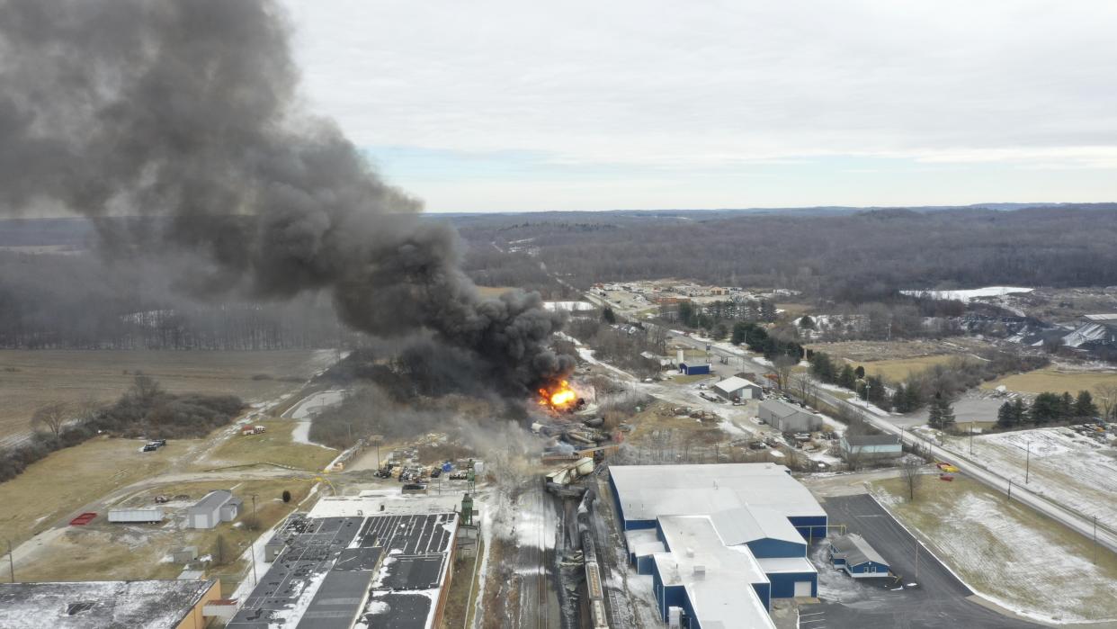 This photo taken with a drone shows portions of a Norfolk and Southern freight train that derailed Friday night in East Palestine, Ohio are still on fire at mid-day Saturday, Feb. 4, 2023. (AP Photo/Gene J. Puskar)