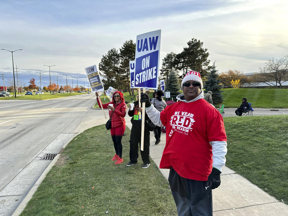 Anthony Collier, 54, and other striking United Auto Workers members picket Saturday, Oct. 28, 2023, outside the Stellantis Sterling Heights Assembly plant in Mich. (AP Photo/Corey Williams)