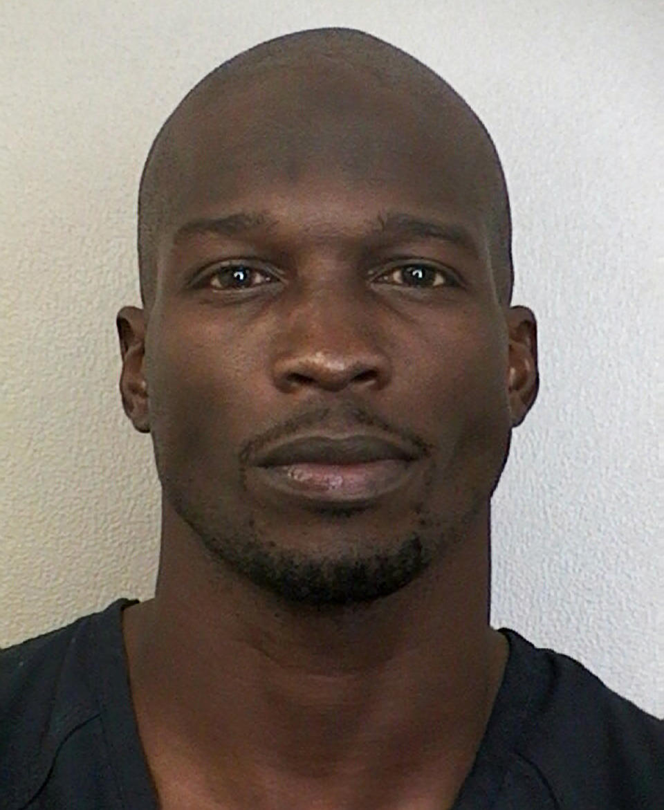 This undated photo provided by the Broward Sheriff's Office shows Miami Dolphins wide receiver Chad Johnson. A judge has set bond at $2,500 for Johnson, who is being held in a Florida jail on a domestic violence charge after his wife accused him of head-butting her during an argument. Johnson's defense attorney, Adam Swickle, says Johnson posted the bond early Sunday, Aug. 12, 2012, though jail records show he had not yet been released. Swickle says a no-contact order has been issued that prevents Johnson from contacting his wife, Evelyn Lozada. (AP Photo/Broward Sheriff's Office)