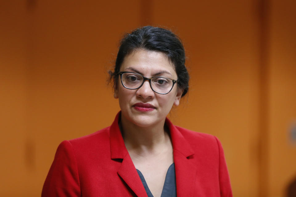 U.S. Rep. Rashida Tlaib, D-Mich., listens to a question from a constituent in Wixom, Mich., Thursday, Aug. 15, 2019. (AP Photo/Paul Sancya)