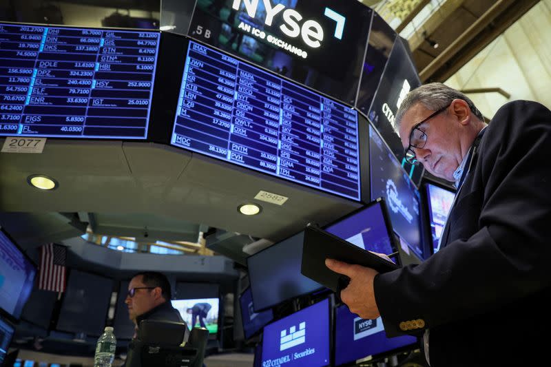 Traders work on the floor of the NYSE in New York