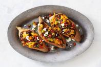 <p>For a fast vegetarian dinner that’s perfect for two, we loaded these baked sweet potatoes with black beans, veggies, and of course, plenty of cheese. </p><p><em><a href="https://www.goodhousekeeping.com/food-recipes/a40931/supercarb-loaded-sweet-potatoes-recipe/" rel="nofollow noopener" target="_blank" data-ylk="slk:Get the recipe for Supercarb Loaded Sweet Potatoes »;elm:context_link;itc:0;sec:content-canvas" class="link ">Get the recipe for Supercarb Loaded Sweet Potatoes »</a></em></p>