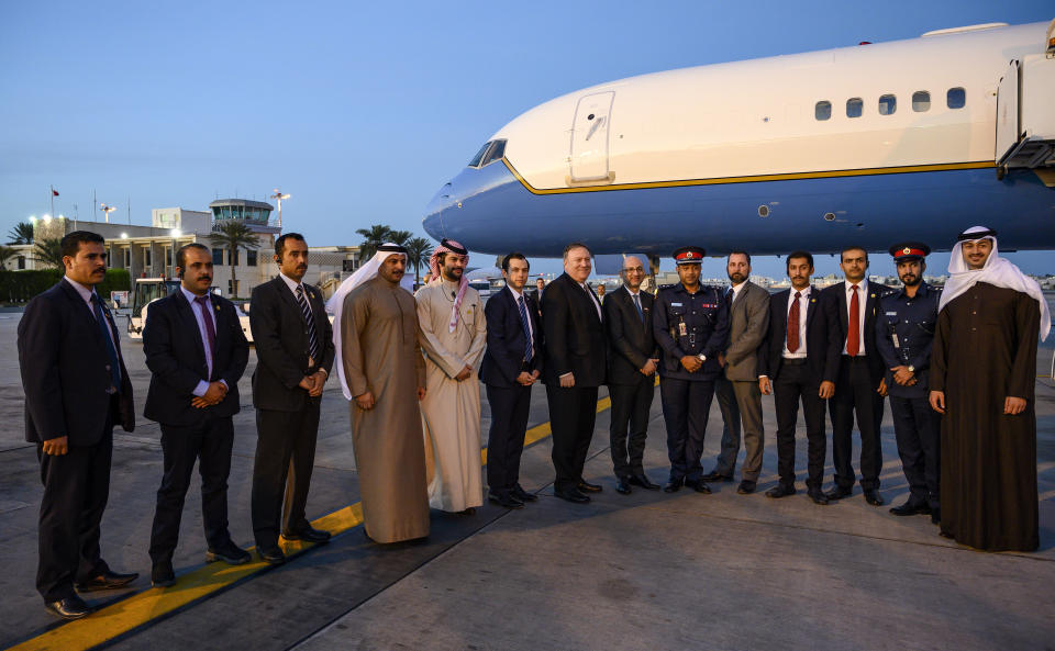 U.S. Secretary of State Mike Pompeo, center, poses with his local security team before departing Manama International Airport in Manama, Bahrain, Friday, Jan. 11, 2019. (Andrew Caballero-Reynolds/Pool Photo via AP)