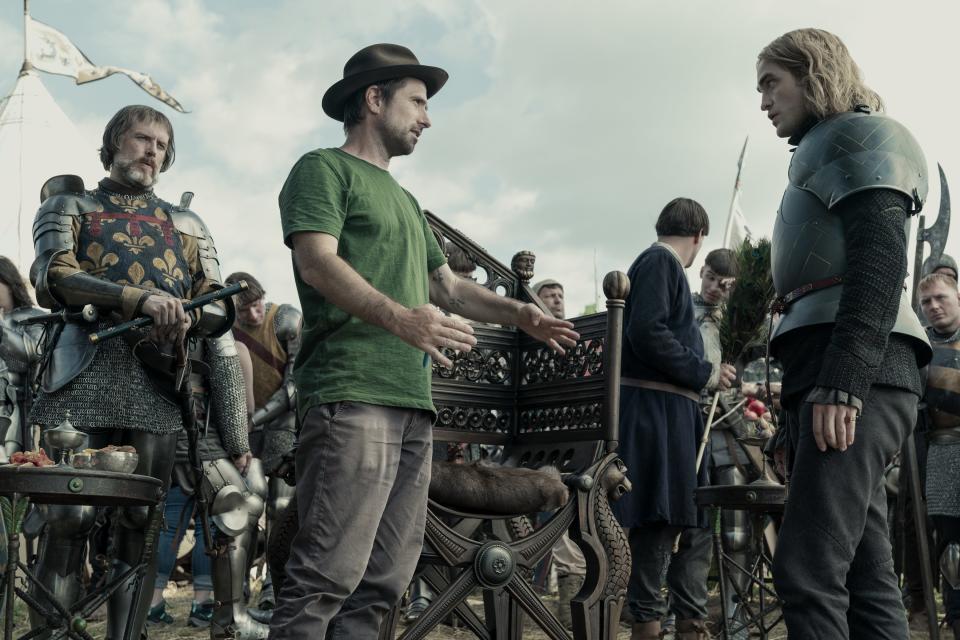 Director David Michôd instructing Robert Pattinson (far right).