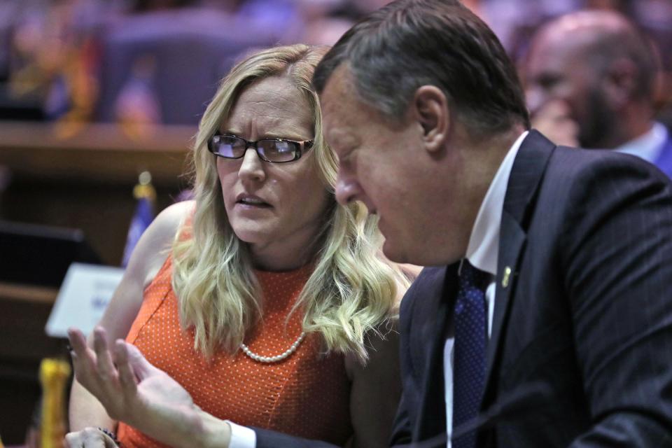 Senator Erin Houchin, left, talks with Senator Eric Koch during a legislative redistricting hearing Wednesday, Aug. 11, 2021 at the Indiana Statehouse in Indianapolis.