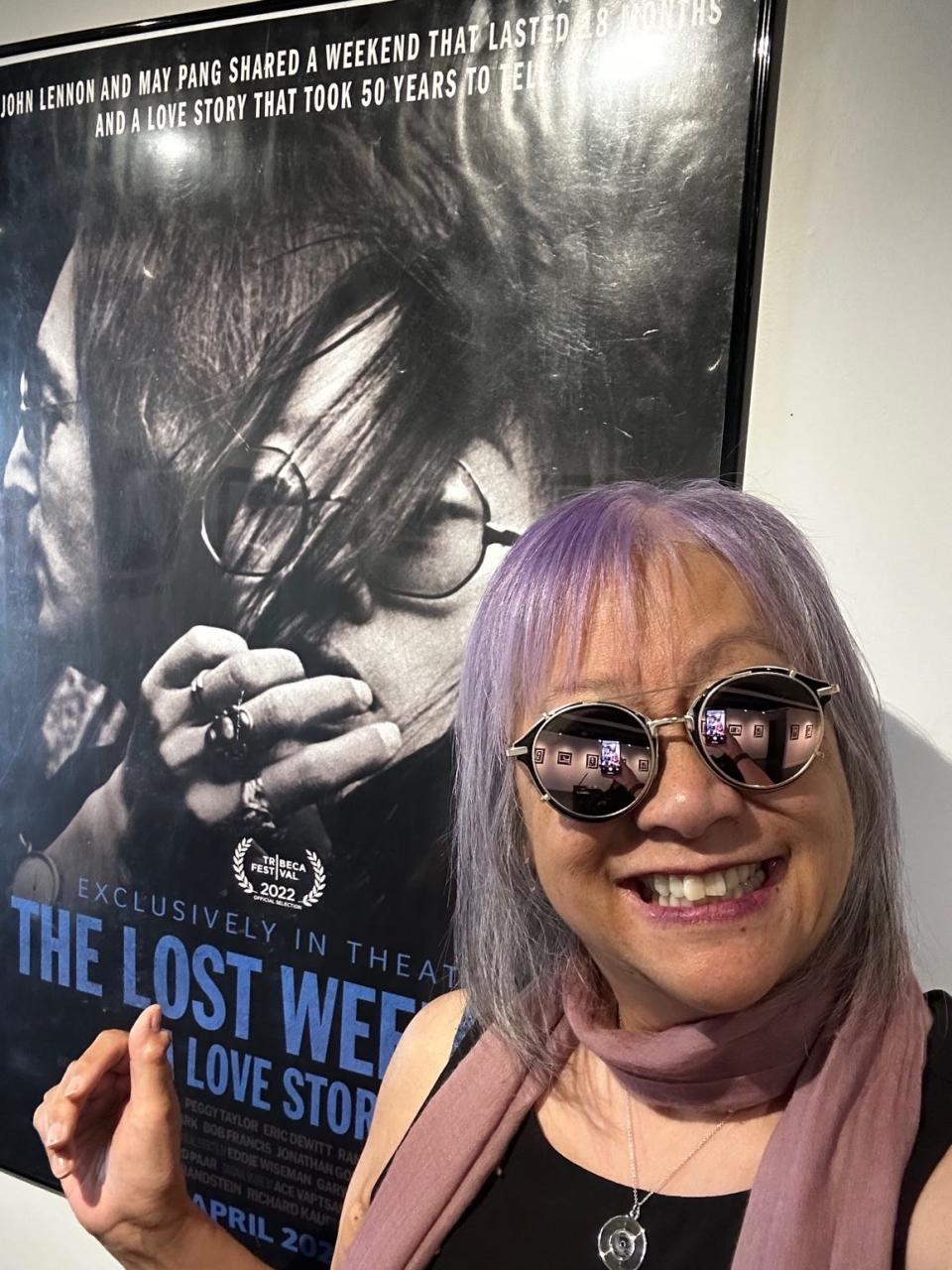 May Pang with movie poster for "The Lost Weekend."