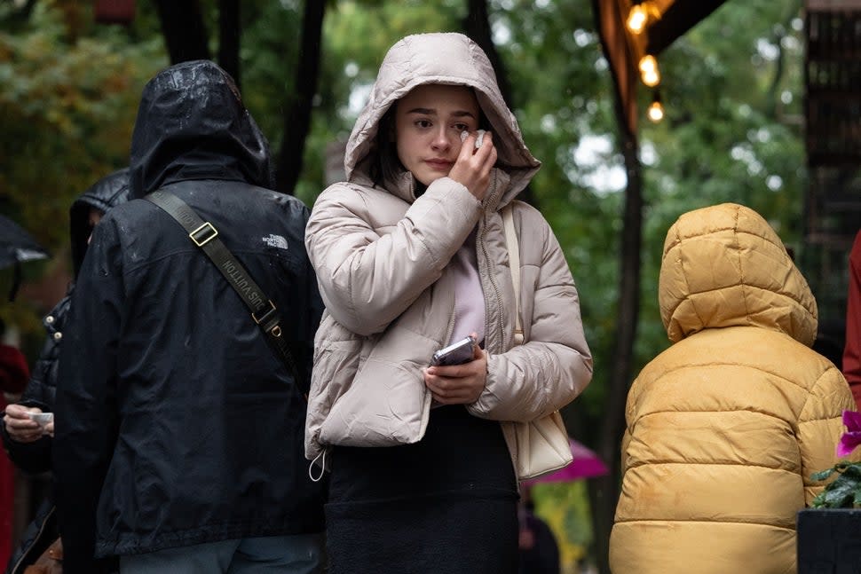 A woman reacts near the apartment building which was used as the exterior shot in the TV show 