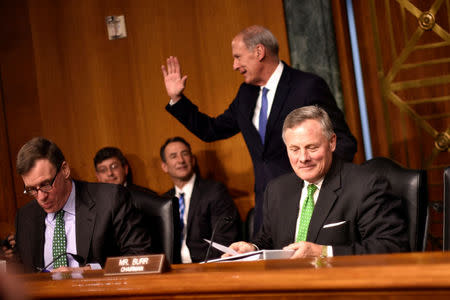 Former U.S. Senator Dan Coats (R-IN) greets senators he formerly served with before testifying before the Senate Select Committee on Intelligence on his nomination to be Director of National Intelligence in Washington February 28, 2017. REUTERS/James Lawler Duggan