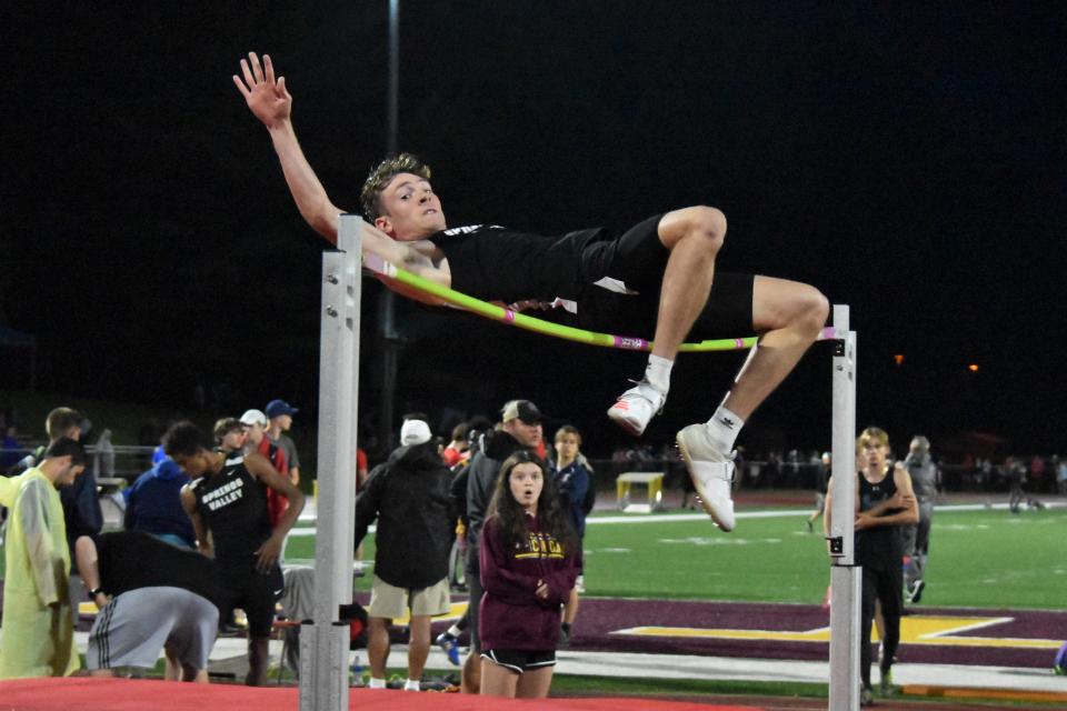 Springs Valley senior Kannon Chase takes flight during the high jump at the 2022 Bloomington North Boys' Track and Field Regional. No other competitor could match his height of 6-5, leading to him winning the Blackhawks' first regional championship.