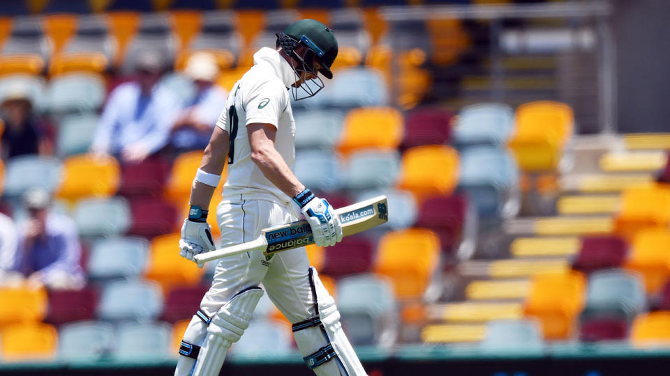 Seen here, Steve Smith walks back to the Gabba pavilion after being removed cheaply.