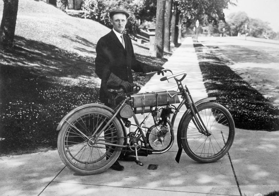 Walter Davidson, the first president of the Harley Davidson Motor Company, poses with his bike after winning the 1908 Federation of American Motorcyclists' endurance run.