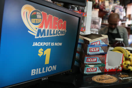 A sign advertising tickets for the $1-billion Mega Millions lottery drawing is seen in Brooklyn, New York, U.S., October 19, 2018. REUTERS/Shannon Stapleton