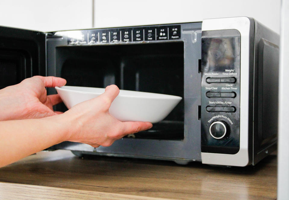 Putting a bowl into a microwave