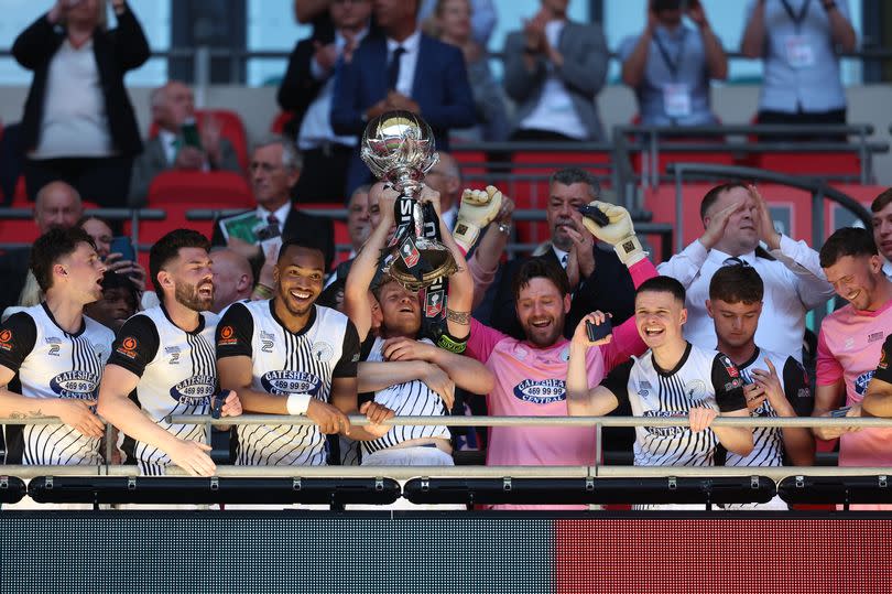 Gateshead FC celebrating at Wembley Stadium after winning the 2024 FA Trophy.