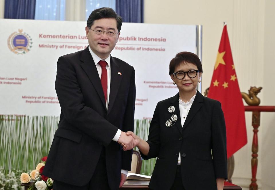 Indonesian Foreign Minister Retno Marsudi, right, shakes hands with her Chinese counterpart Qin Gang during a meeting in Jakarta, Indonesia, in February 2023. Indonesia was among states that refused to back western efforts to suspend Russia from the UN Human Rights Council. (Adek Berry/Pool Photo via AP)