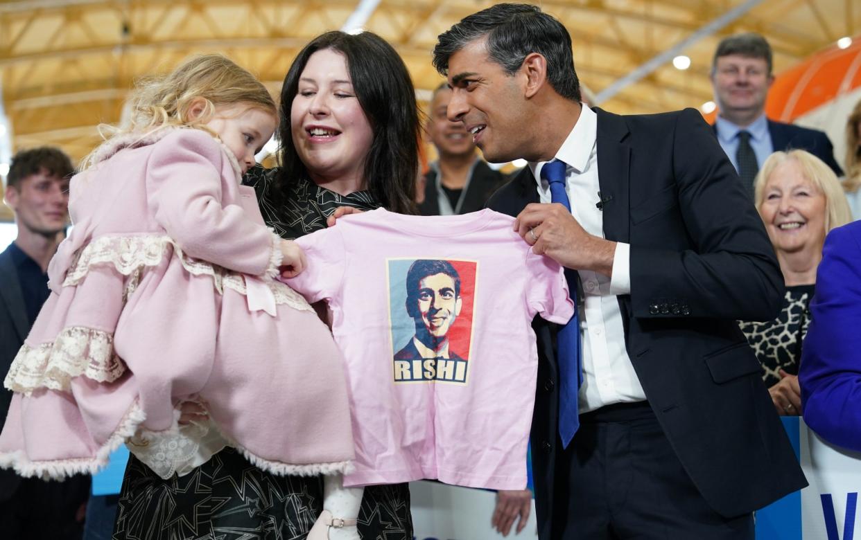 Rishi Sunak posing with Lord Houchen's wife Rachel Houchen and baby Hannah as he celebrates the Tories' Tees Valley mayoral triumph
