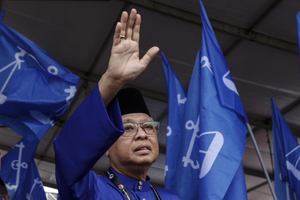 Malaysian Prime Minister Ismail Sabri Yaakob waves to his supporters as he prepares to walk to a nomination center for the upcoming general election in Bera, Malaysia, Saturday, Nov. 5, 2022. Campaigning for Malaysia’s general elections formally started Saturday, in a highly competitive race that will see the world’s longest-serving coalition seeking to regain its dominance four years after a shocking electoral loss. (AP Photo/Ahmad Yusni)