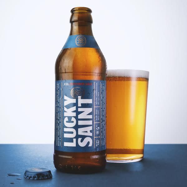 <p><a class="link " href="https://luckysaint.co/products/lucky-saint-0-5-unfiltered-lager-12-pack?variant=31929256738877¤cy=GBP&gclid=CjwKCAiAl4WABhAJEiwATUnEFwOLj58aLBRmdH_ORjqm4jsRAXjEy8cQ1iZo4G-mnpvqOqaoxmfwnxoC_1IQAvD_BwE" rel="nofollow noopener" target="_blank" data-ylk="slk:SHOP;elm:context_link;itc:0;sec:content-canvas">SHOP</a></p><p>A powerfully-flavoured lager despite the lack of alcohol, thanks to the use of a step mash technique that gives the brewers greater control over the wort. It’s full of malt, rounded off with a bit of citrus, and best served icy cold.</p><p>£25 / 12 x 330ml; 0.5% ABV</p>