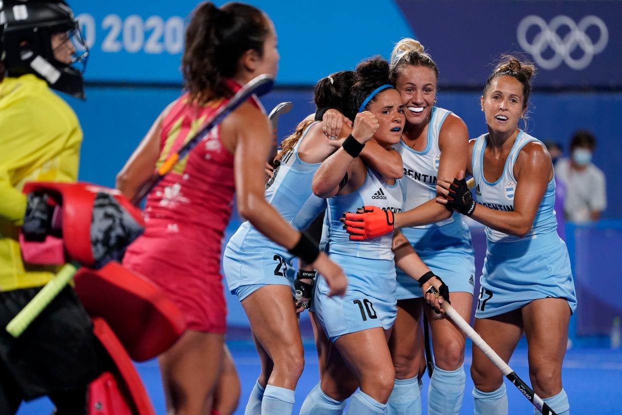 Argentina's Maria Jose Granatto (10) celebrates with her teammates after scoring the go-ahead goal on Japan goalkeeper Sakiyo Asano, left, during a women's field hockey match at the 2020 Summer Olympics, Thursday, July 29, 2021, in Tokyo, Japan.