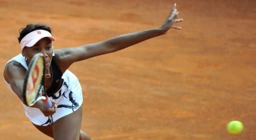 American Venus Williams returns a ball during her quarter-final match against Rusia's Maria Sharapova at the WTA Rome tournament. Sharapova won 6-4, 6-3