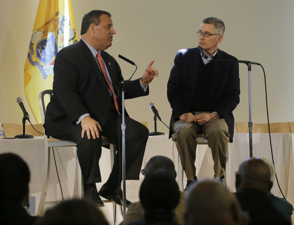 New Jersey Gov. Chris Christie, left, answers a question from former Gov. Jim McGreevey as they sits on a stage during a conference in Jersey City, N.J., Thursday, April 17, 2014. The event focused on providing post-prison services that reduce recidivism. (AP Photo/Mel Evans)