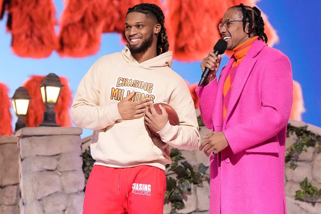 THE MASKED SINGER: L-R: Damar Hamlin and host Nick Cannon in the “Sesame Street Night” episode of THE MASKED SINGER airing Wednesday, March 15 (8:00-9:01 PM ET/PT) on FOX