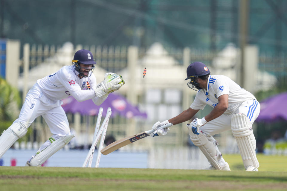 India's captain Rohit Sharma, right is stumped out by England's Ben Foakes on the fourth day of the fourth cricket test match between England and India in Ranchi, India, Monday, Feb. 26, 2024. (AP Photo/Ajit Solanki)