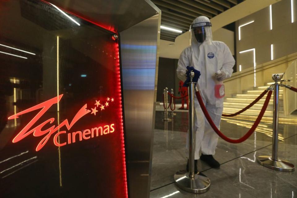 A worker in a protective suit conducts sanitisation work at TGV Cinemas in Central I-City, Shah Alam September 14, 2021. — Yusof Mat Isa