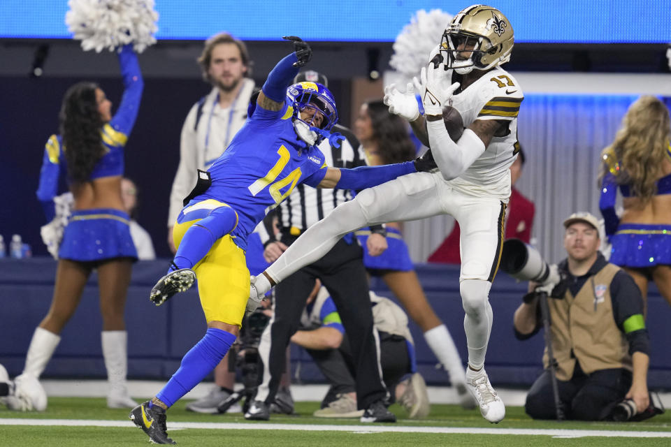 New Orleans Saints wide receiver A.T. Perry (17) makes a touchdown catch past Los Angeles Rams cornerback Cobie Durant (14) during the second half of an NFL football game Thursday, Dec. 21, 2023, in Inglewood, Calif. (AP Photo/Ashley Landis)