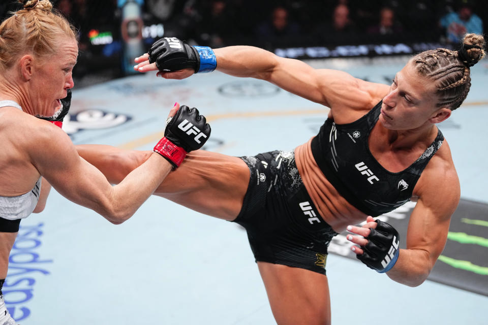 LAS VEGAS, NEVADA - APRIL 13: (R-L) Kayla Harrison kicks Holly Holm in a bantamweight fight during the UFC 300 event at T-Mobile Arena on April 13, 2024 in Las Vegas, Nevada. (Photo by Jeff Bottari/Zuffa LLC via Getty Images)