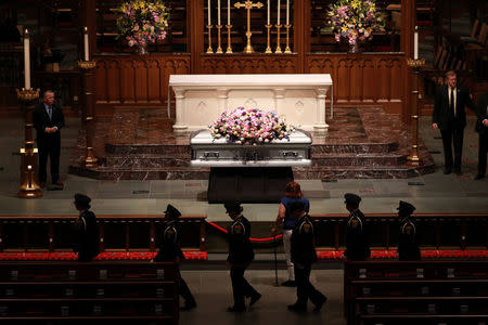 Members of the public visit Former U.S. first lady Barbara Bush, the wife of the 41st president, George H.W. Bush, and mother of the 43rd, George W. Bush, as she lies in repose at St. Martin's Episcopal Church in Houston, Texas, U.S., April 20, 2018. REUTERS/Richard Carson