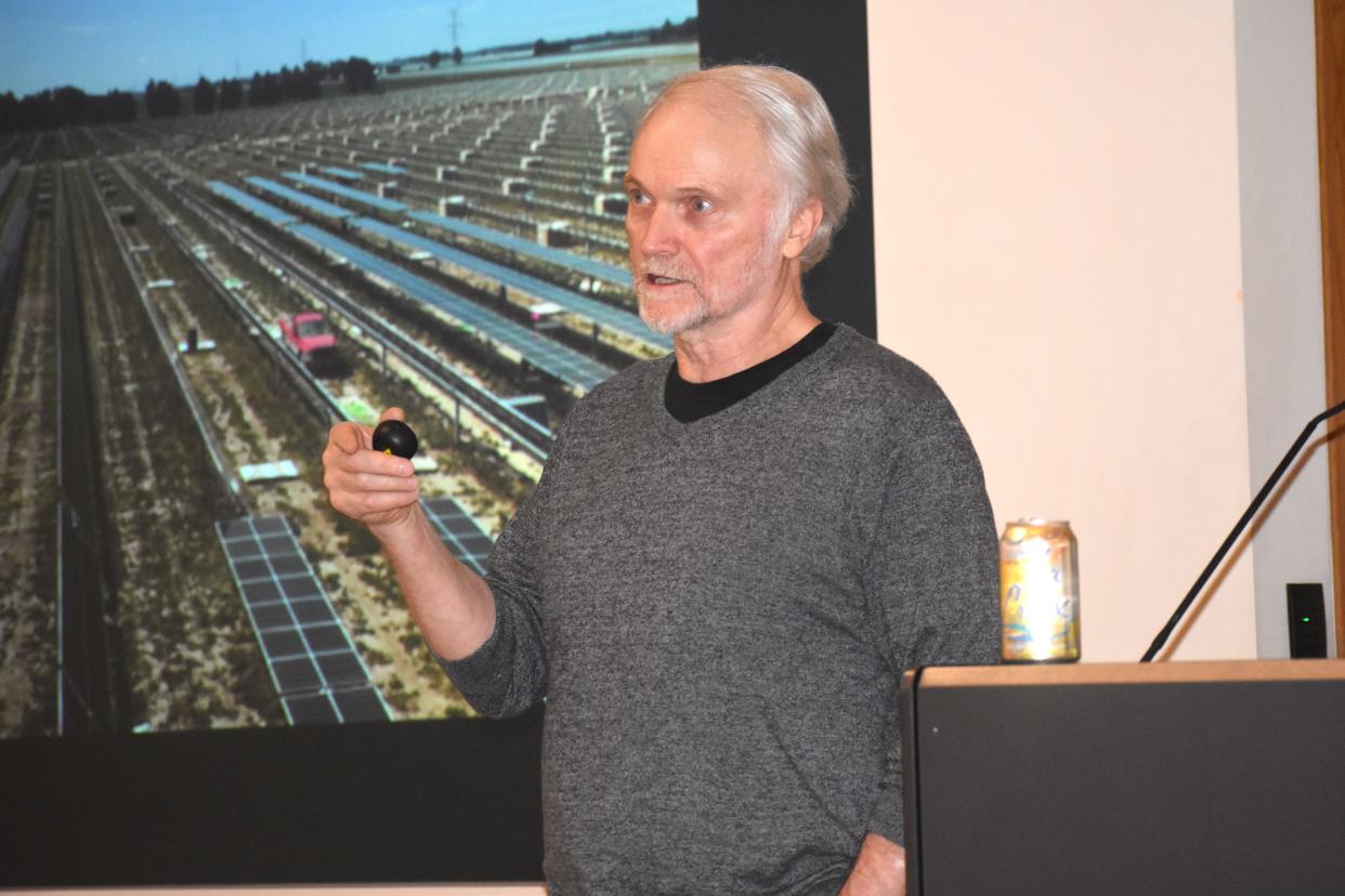 Peter Sinclair, a Michigan-based videographer specializing in energy and the environment, speaks to a crowd of at least 30 people May 4 at Siena Heights University. Sinclair's "Sun 101" presentation about solar, wind and other renewable forms of energy was supported by the university's Sustainable College Committee.