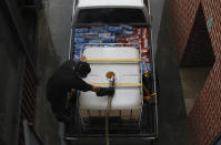 In this photo taken Friday, May 15, 2020, soup is being cooked in a beer tank at Woodstock Brewery in Cape Town, South Africa. The country has restricted the sale of cigarettes and alcohol during the coronavirus lockdown, but the brewery has adapted to the ban by using its large vats to cook meals for the poor. (AP Photo/Nardus Engelbrecht)