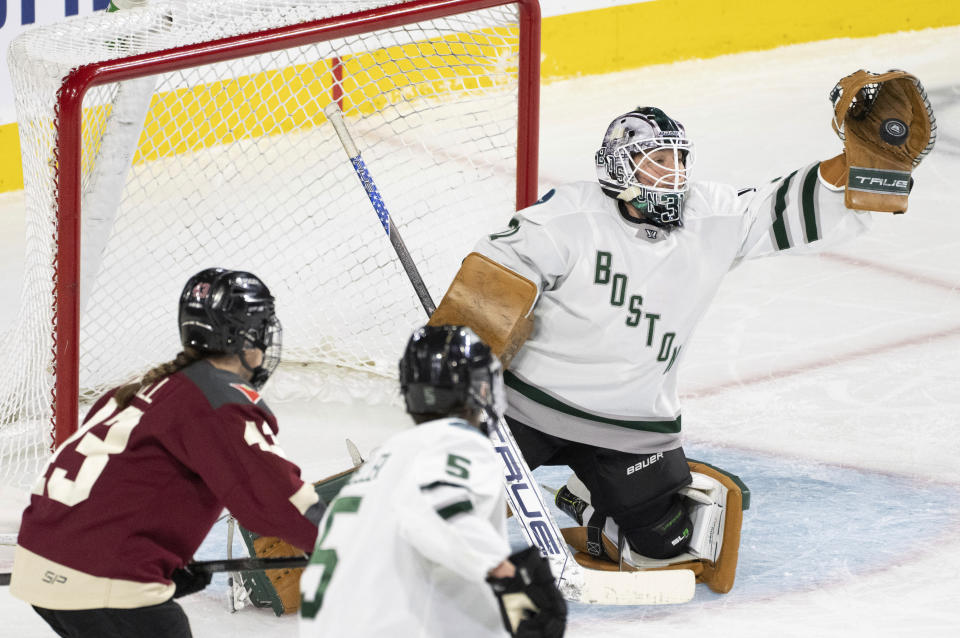 Boston goaltender Aerin Frankel (31) makes a save against Montreal's Kristin O'Neill (43) during the third period of Game 1 of a PWHL hockey playoff series Thursday, May 9, 2024, in Montreal. (Christinne Muschi/The Canadian Press via AP)