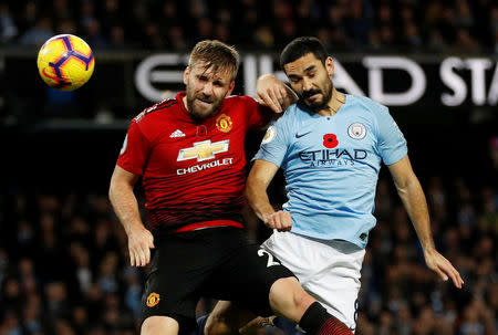 Soccer Football - Premier League - Manchester City v Manchester United - Etihad Stadium, Manchester, Britain - November 11, 2018 Manchester United's Luke Shaw in action with Manchester City's Ilkay Gundogan REUTERS/Darren Staples