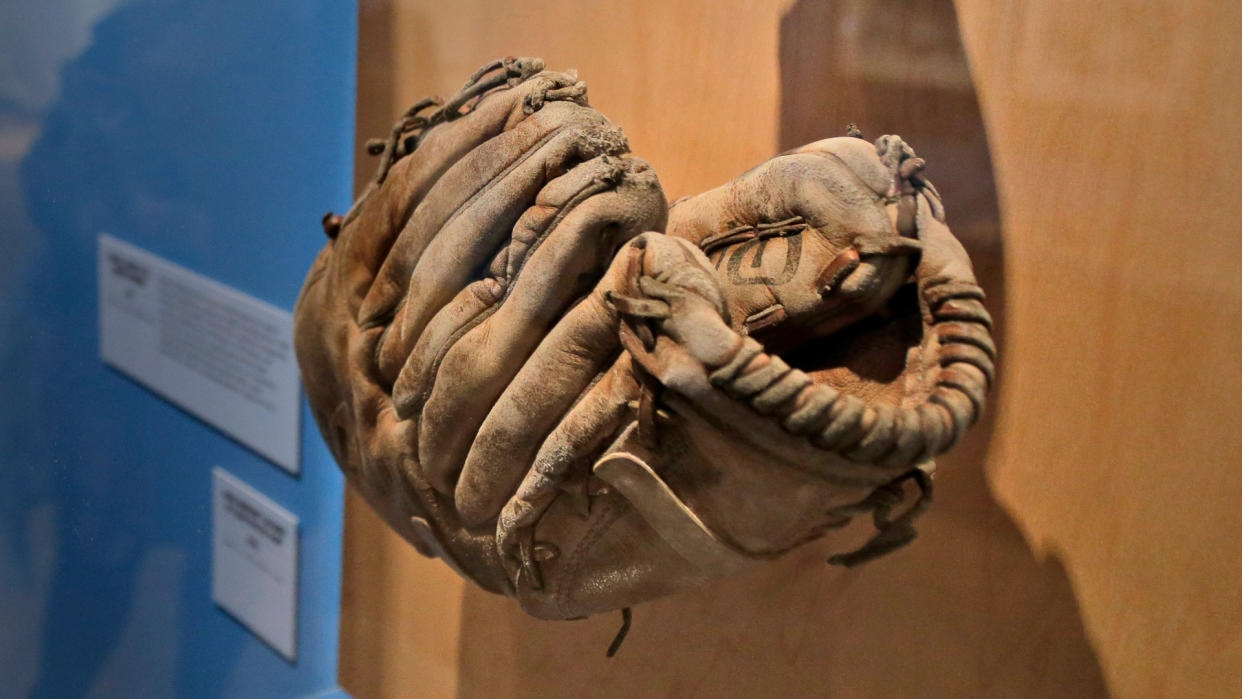 Mandatory Credit: Photo by Seth Wenig/AP/Shutterstock (10077221f)A glove used by Brooklyn Dodgers baseball player Jackie Robinson is displayed at the exhibit "In the Dugout with Jackie Robinson: An Intimate Portrait of a Baseball Legend" at the Museum of City of New York in New York.