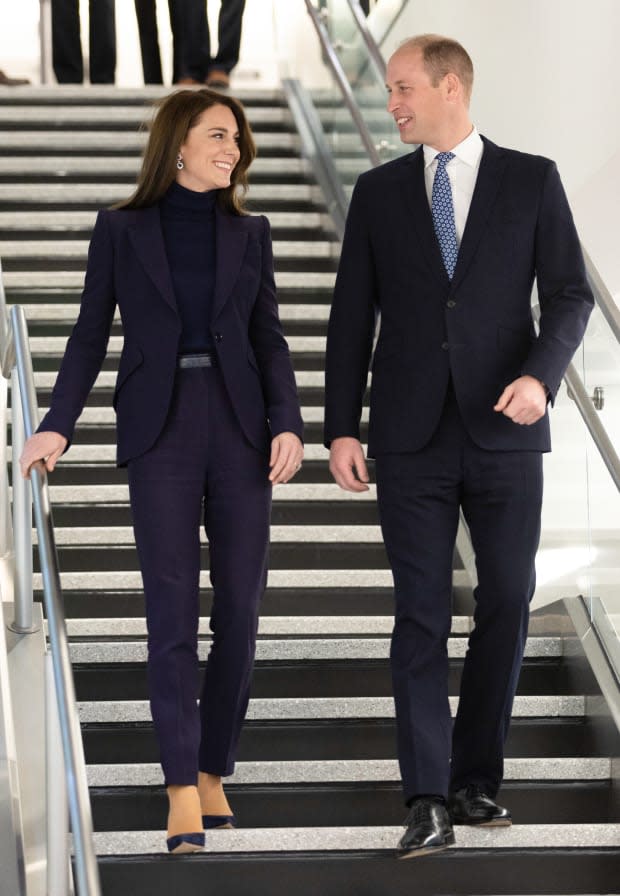 <p>Kate Middleton wears a deep indigo suit and heels as she and Prince William arrive in Boston on Nov. 30, 2022.</p><p>Samir Hussein - Pool/WireImage</p>