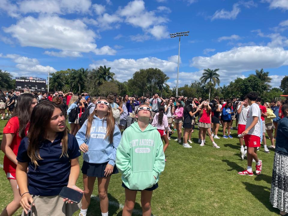 Students at Saint Andrew's School in Boca Raton flocked to the school's football field to watch the solar eclipse on April 8, 2024.