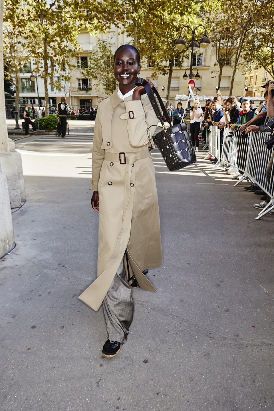 A model at Stella McCartney's spring 2024 show carrying a bag made from upcycled grape waste.