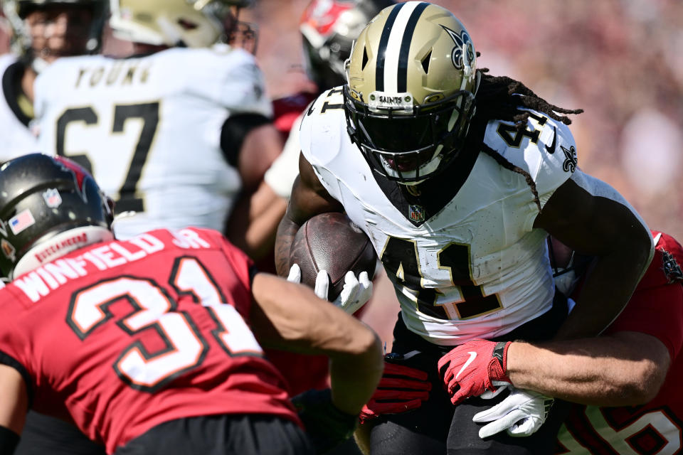 TAMPA, FLORIDA – DECEMBER 31: Alvin Kamara #41 of the New Orleans Saints runs with the ball during the first quarter against the Tampa Bay Buccaneers at Raymond James Stadium on December 31, 2023 in Tampa, Florida. (Photo by Julio Aguilar/Getty Images)