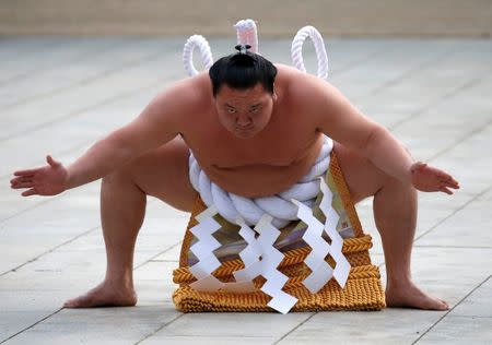 Mongolian-born grand sumo champion Yokozuna Hakuho performs the New Year's ring-entering rite at the annual celebration for the New Year at Meiji Shrine in Tokyo, Japan, January 6, 2017. REUTERS/Issei Kato